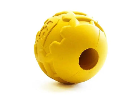 The SodaPup ID Ball Durable Rubber Chew Ball is a yellow power chewer toy made from natural rubber with textured patterns, dental ridges, and a large central hole, shown on a white background.