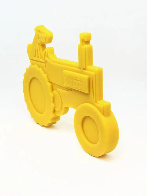The SodaPup ID Tractor Ultra Durable Nylon Dog Chew Toy features a tractor design with a dog on the seat, large circular wheels, and embossed details—perfect for power chewers and helps reduce problem behaviors.