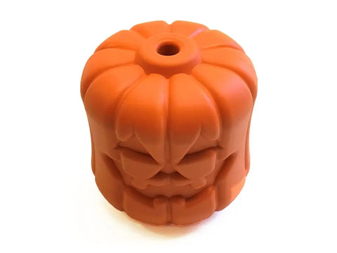 The SodaPup Jack O Lantern EDispener is a durable orange rubber chew toy and treat dispenser shaped like a pumpkin with a carved face, resembling a jack-o-lantern.
