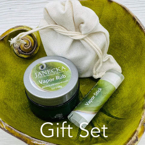 A green dish holds a jar of JANECKA Herbal Vapor Rub by Janecka Skincare, a vapor stick, and a small drawstring pouch. The words Gift Set appear at the bottom of the image.