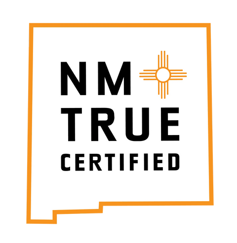 Logo shaped like New Mexico with an orange outline, featuring NM TRUE CERTIFIED and an orange Zia symbol—ideal for Janecka Skincares JANECKA Herbal Vapor Rub, perfect for organic congestion relief.