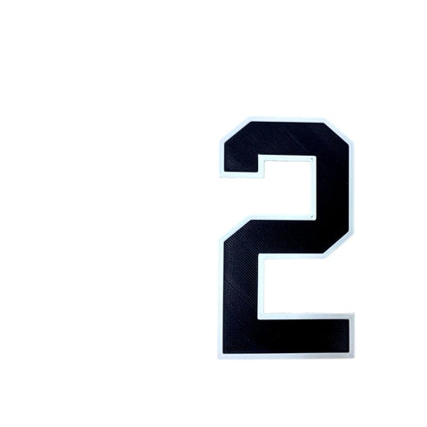 The BOGLETS - Jersey Sports Uniform T-Shirt Number by Chatelet Manufacturing features a large black number 2 with a white border on a plain white background, ideal for customizing bag charms or accessorizing tote bags.