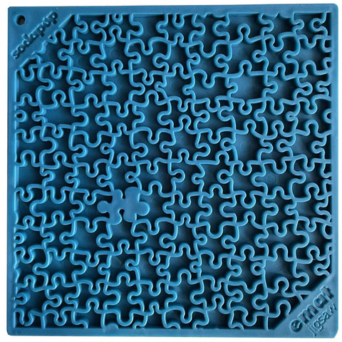 The SodaPup Jigsaw Design EMat Enrichment Lick Mat is a blue silicone, square-shaped mat with intricate maze-like grooves designed to hold treats or food, providing a fun and engaging enrichment experience for dogs.