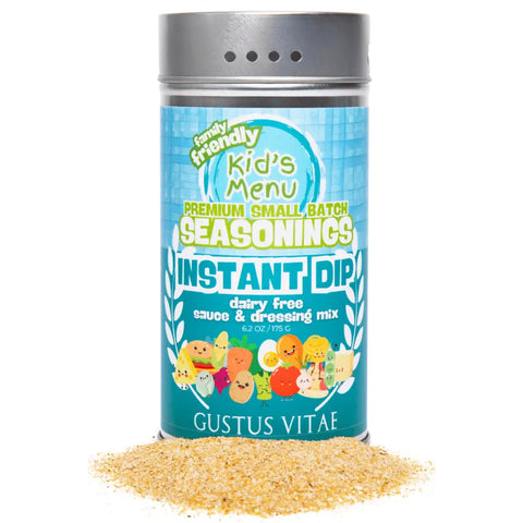A container of Gustus Vitae Kid’s Menu: Instant Dip: Dairy-Free Sauce & Dressing Mix sits with yellow powder spilled in front. The blue label shows cartoon vegetables and bold, colorful text.