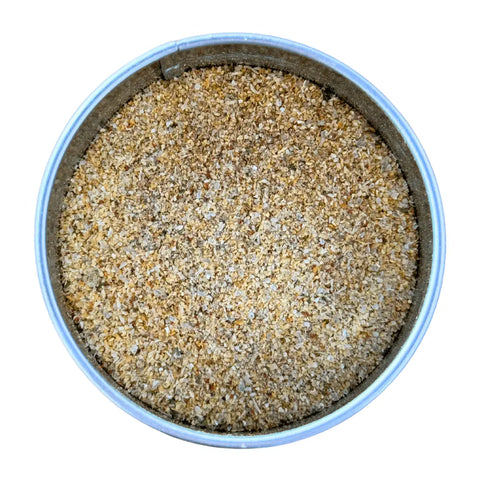 A round metal tin of Gustus Vitae Kid’s Menu: Instant Dip Dairy-Free Sauce & Dressing Mix, filled with finely ground light brown vegan blend, viewed from above against a white background.