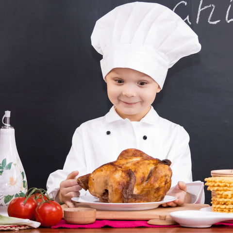 A young chef beams at a plate of chicken tenders and fries, seasoned with Gustus Vitaes Kid’s Menu: Chicken - Tendies & Fries Gourmet Seasoning Mix. All-natural ingredients shine against a playful chalkboard backdrop.