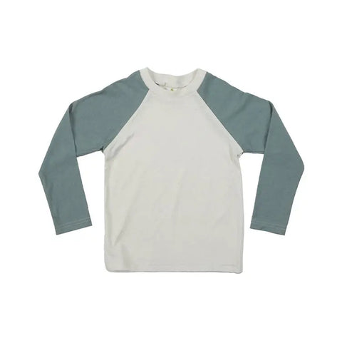 The Spiritex | Sustainable Apparel Long Sleeve Baseball Tee for kids features an off-white body with light blue sleeves, made from organic cotton in the USA. Shirt is shown laid flat on a white background.