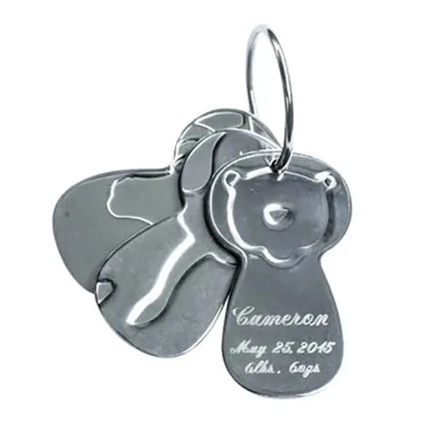 Kleynimals – Clean Key Animals® by Kleynimals are three stainless steel keychains shaped like animal heads, including one engraved with a bear face and custom text (e.g., Cameron, May 25, 2015), for a unique keepsake.