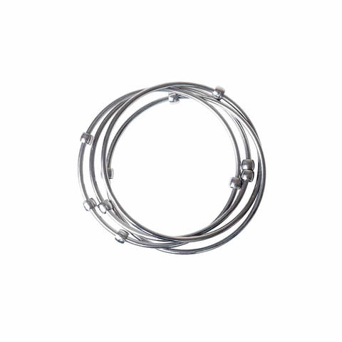 Kleynimals Stainless Steel Jangles® by Kleynimals features three intertwined, bead-accented bracelets designed as stylish chewable jewelry for moms and a safe baby fidget toy, shown on a white background.