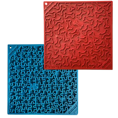 The SodaPup Large Blue Jigsaw & Large Red Bones EMat Lick Mat Bundle includes two silicone mats that enrich dogs mealtimes, serving as slow feeders and engaging enrichment toys.