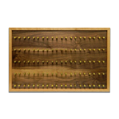 The ORIGINAL Brass Casing Challenge Coin Display - Large by Legacies of America Woodworking Company features five rows of brass pegs on a natural, American-made hardwood board with a light wood frame, mounted horizontally.