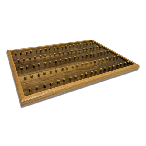 The ORIGINAL Brass Casing Challenge Coin Display - Large by Legacies of America Woodworking Company is an American-made, veteran-built wooden case with a glass top, featuring neat rows of brass bullet casings inside.