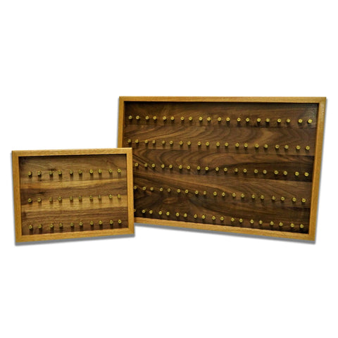 The ORIGINAL Brass Casing Challenge Coin Display - Large by Legacies of America Woodworking Company features wooden boards with a smooth, polished finish and grid-patterned brass pegs. Available in different sizes for versatile display.