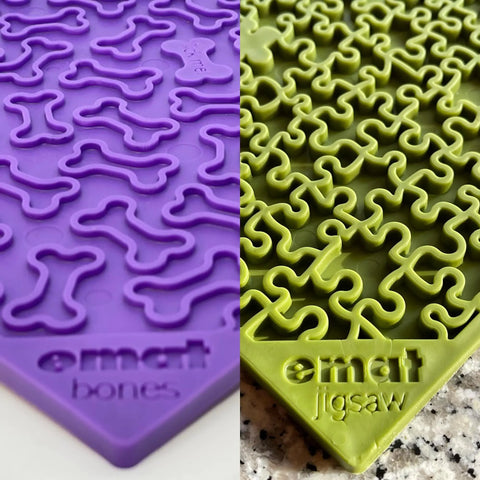 Close-up of SodaPups Large Green Jigsaw & Large Purple Bones EMat Lick Mat Bundle: two textured silicone mats, one with a jigsaw pattern and one with a bone pattern—perfect as slow feeder dog lick mats.