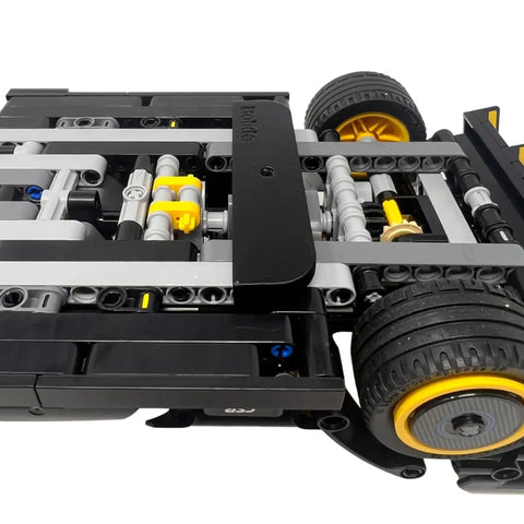 Close-up of a Chatelet Manufacturing Collectible Car Wall Mount, compatible with Lego Technic Lamborghini Huracán Tecnica 42161. Features vertical chassis display with screw; made in USA. Viewed from the side and slightly below.