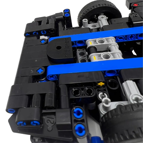 Close-up of a LEGO Technic vehicle with black, blue, and gray pieces. Display your 42161 Lamborghini Huracán Tecnica build on a Chatelet Manufacturing Collectible Car Wall Mount—vertical chassis display, made in the USA with included screw.