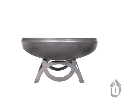 The Liberty Fire Pit With Curved Base by Ohio Flame features a round, black steel bowl on a sturdy geometric stand. Made in the USA, it includes a flame logo and comes with a lifetime warranty for peace of mind.