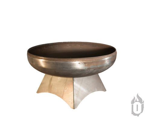 The Ohio Flame Liberty Fire Pit With Standard Base, made in the USA, features a round steel bowl on a sturdy curved base. Set against a plain white background, a small flame icon is shown in the bottom right corner.