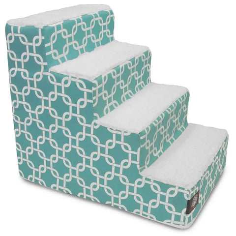 The Majestic Pet Links 4 Step Pet Stairs (Heavy-Duty) feature teal and white geometric sides and plush Sherpa cushions on each step, helping your dog or cat comfortably reach higher places in style.