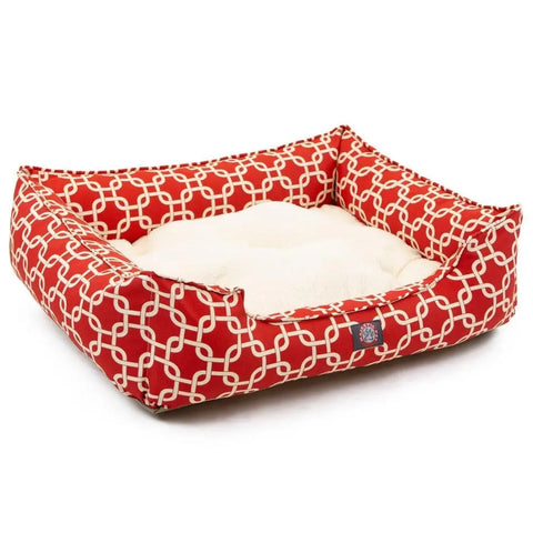 The Majestic Pet Links Contemporary Lounge Bed offers a luxurious red bed with white geometric patterns, a soft cream cushion, and premium fiberfill. The machine washable slipcover ensures easy cleaning.