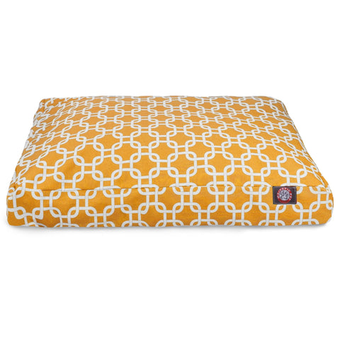 The Majestic Pet Links Rectangle Dog Bed features a washable yellow cover with a white interlocking geometric pattern, a small bottom right label, and a removable cover for easy cleaning.