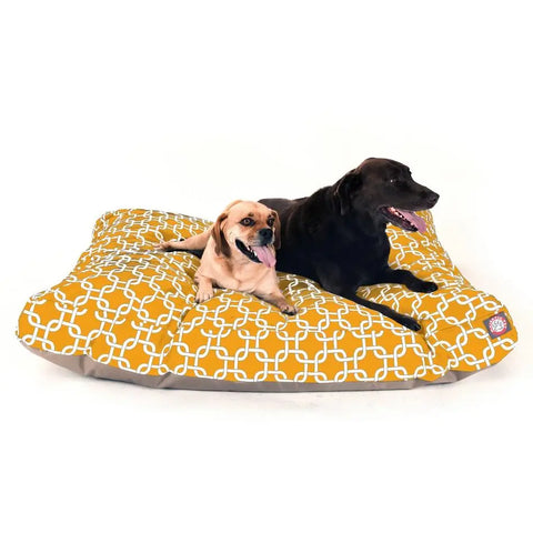 A small tan dog and a large black dog relax with mouths open on the Majestic Pet Links Rectangle Dog Bed, featuring a yellow cover with a white geometric pattern that’s comfy and removable.