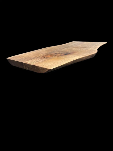 The B. James Design & Woodwork Live Edge Ambrosia Maple Serving Tray features natural edges and a smooth surface, showcased against a solid black background.