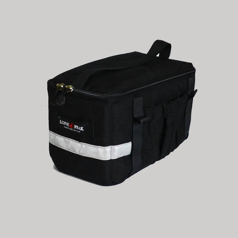 A black rectangular Lone Peak Basic Rack Pack by Lone Peak Packs with a top handle, zipper closure, side pockets, and a reflective strip, shown on a gray background. Ideal as an insulated bike bag for all your cycling needs.