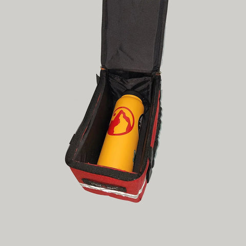 A yellow water bottle with a red mountain logo sits inside an open, rectangular red Lone Peak Basic Rack Pack by Lone Peak Packs, set against a plain gray background.