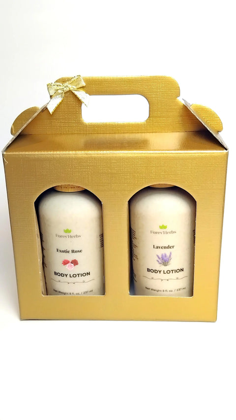The Lotion Gift Set by Forev'Herbs includes two bottles of rose and lavender lotion with natural ingredients, presented in a gold gift box with a small bow and top handle.
