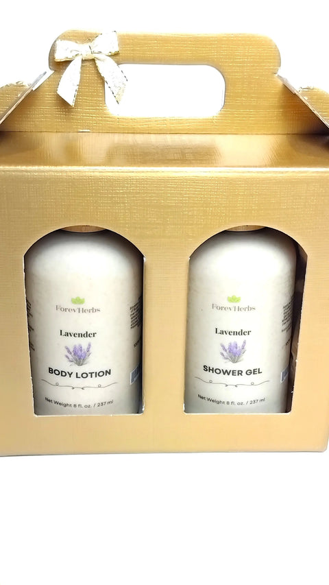 A gold gift box with handle and bow featuring Forev'Herbs Lotion / Shower Gel Gift Set in Lavender. Each 8 fl. oz. (237 ml) bottle pampers with nourishing lotion and refreshing shower gel, offering an exquisite fragrance.