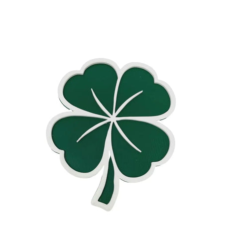 The Chatelet Manufacturing Saint Patricks Day Lucky Shamrock Fridge Magnet features a green four-leaf clover with a white outline—perfect decorative touch for Saint Pattys Day celebrations, proudly made in the USA.