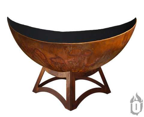 The Ohio Flame Lunar Fire Bowl With Hollow Base (Made in USA) features a large rust-colored half-sphere on a sturdy geometric stand, displayed on a white background with the brands logo in the bottom right corner.