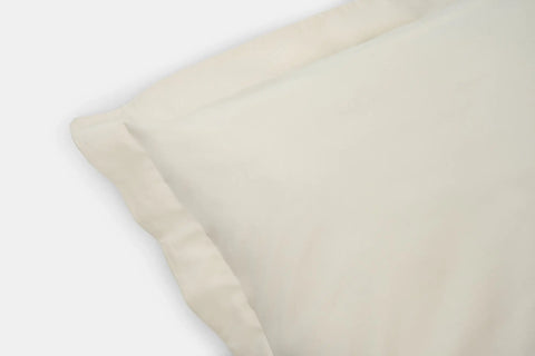 A close-up of the American Blossom Linens Cotton Duvet Cover Set shows its smooth fabric and refined edges, displayed against a white background.
