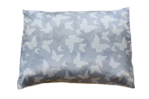 The Morning Glamour Satin Pillowcase Standard/Queen 2PK, available in multiple prints, features a smooth, light gray surface with white butterfly accents and helps reduce frizz while you sleep.