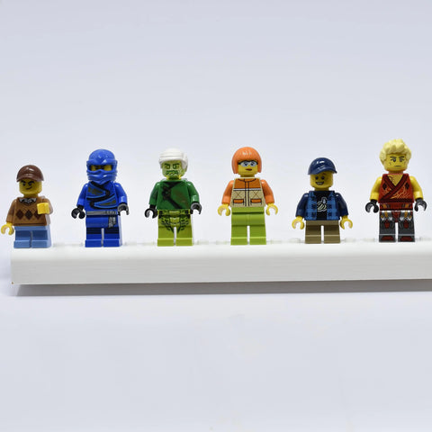Six LEGO minifigures are displayed on the Chatelet Manufacturing Collectibles Display Fridge Magnet, compatible with LEGO minifigures, perfect for showcasing your figurines on any fridge or metal surface. Made in USA.