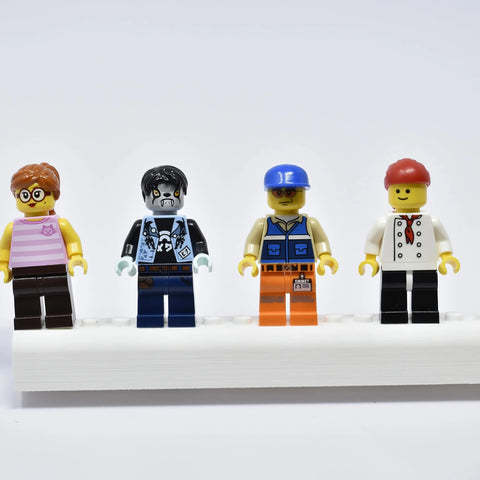 Four LEGO minifigures stand on a Collectibles Display Fridge Magnet by Chatelet Manufacturing, perfect for showcasing your favorite figurines on fridges or metal surfaces—compatible with Lego minifigures and made in USA.