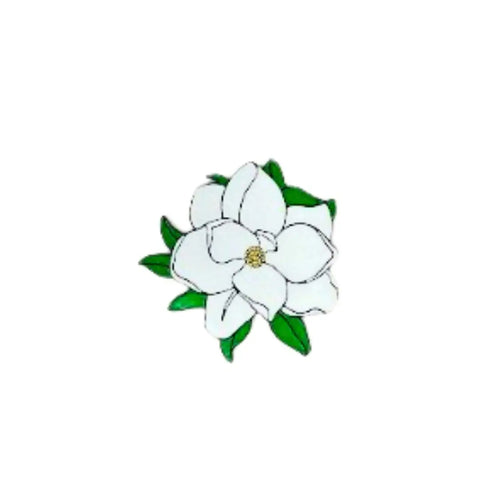 A simple white magnolia flower with green leaves, featured on the Chatelet Manufacturing Baglets - Magnolia Charm, a decorative charm for tote bags compatible with Bogg Bags, Simply Southern, and more.