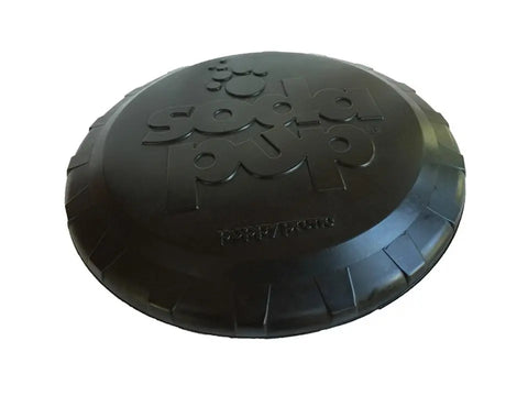 The SodaPup Magnum Bottle Top Flyer is a large, ultra-durable black rubber frisbee dog toy with embossed paw prints, shown on a white background.