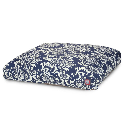 The Majestic Pet French Quarter Rectangle Dog Bed features a blue and white floral damask pattern, a small red logo tag, and a removable washable cover for easy cleaning. Shown against a white background.