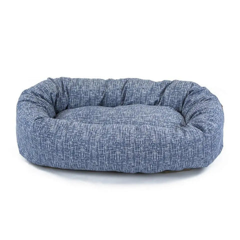 The Majestic Pet Palette Heathered Bagel Dog Bed is a soft, rectangular blue bed with raised cushioned sides for spine support and a water-resistant, textured fabric surface, shown on a white background.