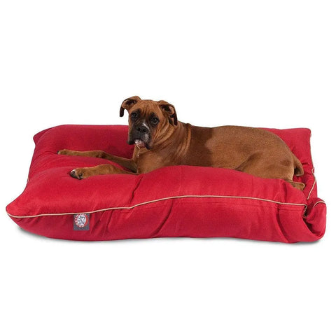 A brown dog rests on a Majestic Pet Poly/Cotton Super Value Dog Bed, shown against a white background.