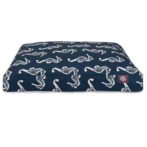 The Majestic Pet Sea Horse Rectangle Dog Bed features a navy blue, washable cover with a white seahorse pattern and a small red and white logo tag, shown against a white background.