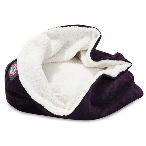 The Majestic Pet Villa Burrow Cat Bed features a soft, dark purple faux suede exterior and white sherpa lining, with a partially open, cave-like design for feline comfort and a small circular logo patch on the side.