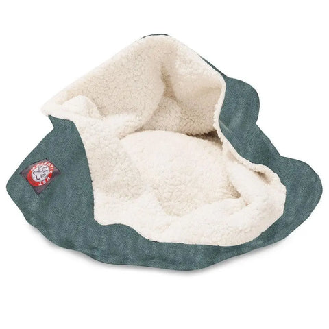 The Majestic Pet Villa Burrow Cat Bed features a soft cream sherpa lining, dark green faux suede exterior, and a small paw print patch for feline comfort. Its cozy design is partially folded open for easy access.