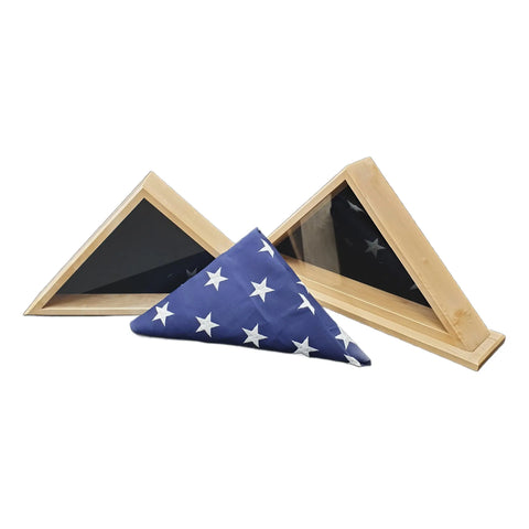 Two Legacies of America Woodworking Company Maple 4x6 Flag Display Cases sit behind a neatly folded American flag with white stars on blue. The wooden cases, veteran-built, are designed to hold burial flags and appear empty.