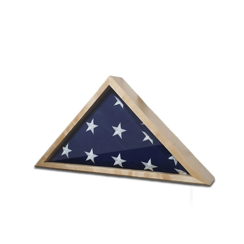The Legacies of America Woodworking Companys Maple 4x6 Flag Display Case presents a folded American flag with white stars on a blue field inside a triangular maple case, honoring tradition and service.
