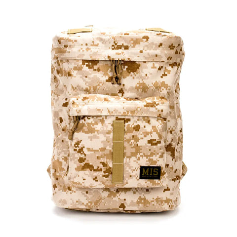 The MIS Backpack - MarPat Desert features a tan and brown digital camo Cordura Nylon design with a front zip pocket, padded laptop holder, top handle, and black MIS patch. Water-resistant, its shown against a white background.