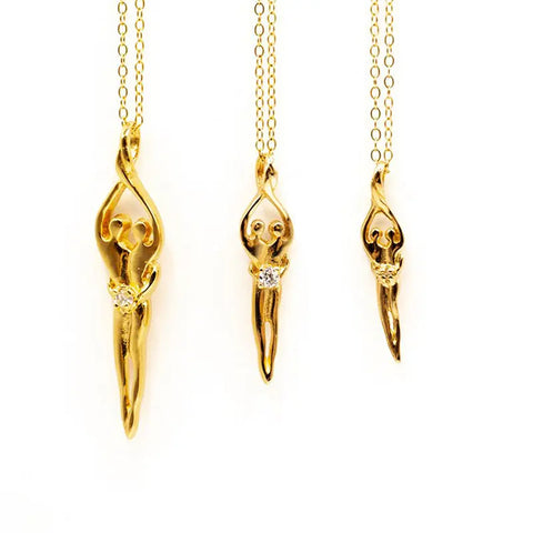 The Medium Soulmate Necklace by Symbol of Love Jewelry features a stylized female pendant with a ruby cubic zirconia at the waist, crafted from .925 sterling silver with 14kt gold overlay on an 18 chain (charm: 1⅛ x ⅜).