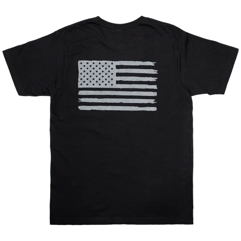 The Tattered Flag - Mens Cotton T-Shirt (Black) by Proudly USA features a distressed, monochrome American flag graphic on the back, giving this patriotic shirt a bold vintage style.